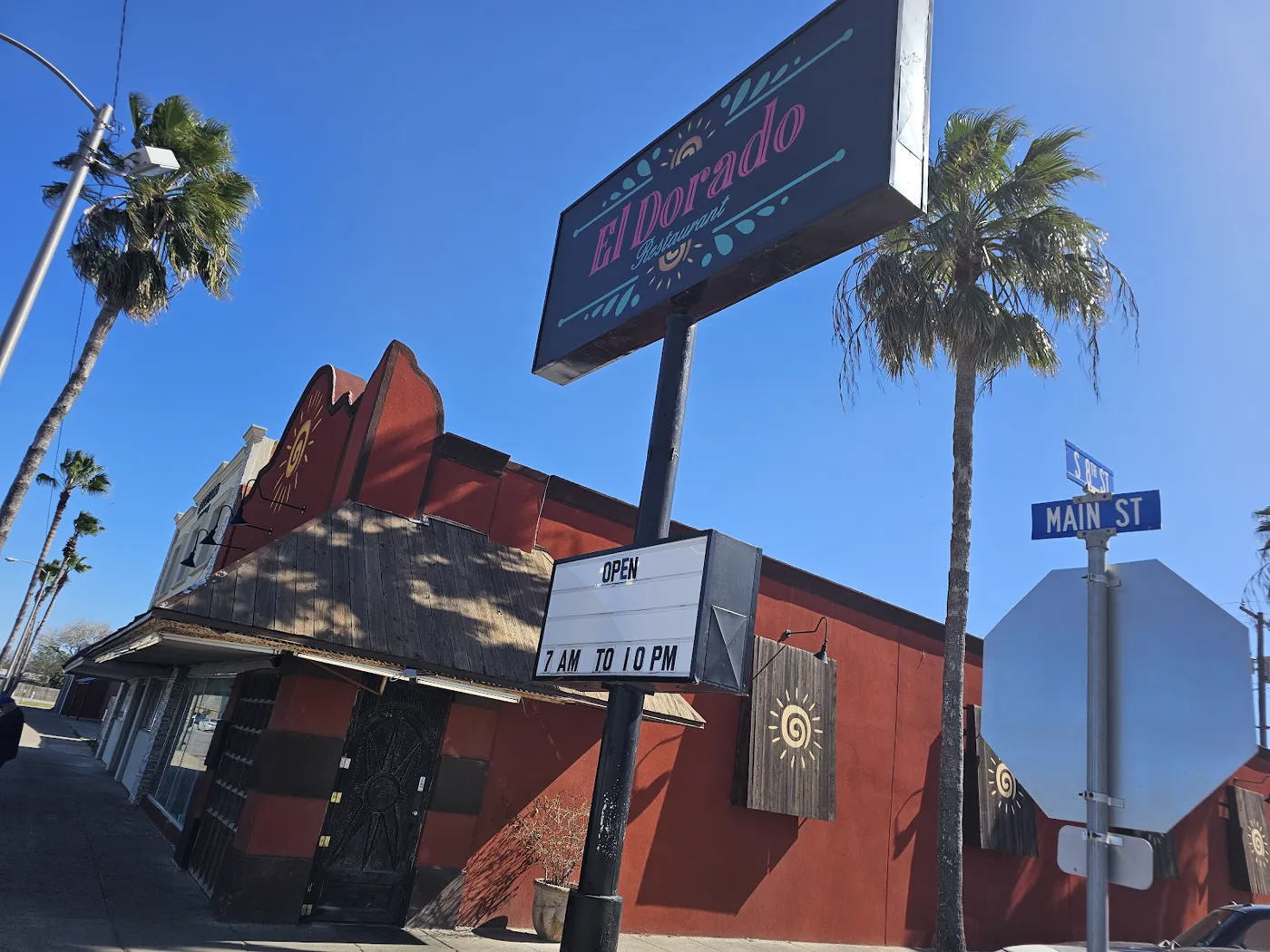 The red exterior and roadside sign of El Dorado Restaurant at Main Street in Alamo